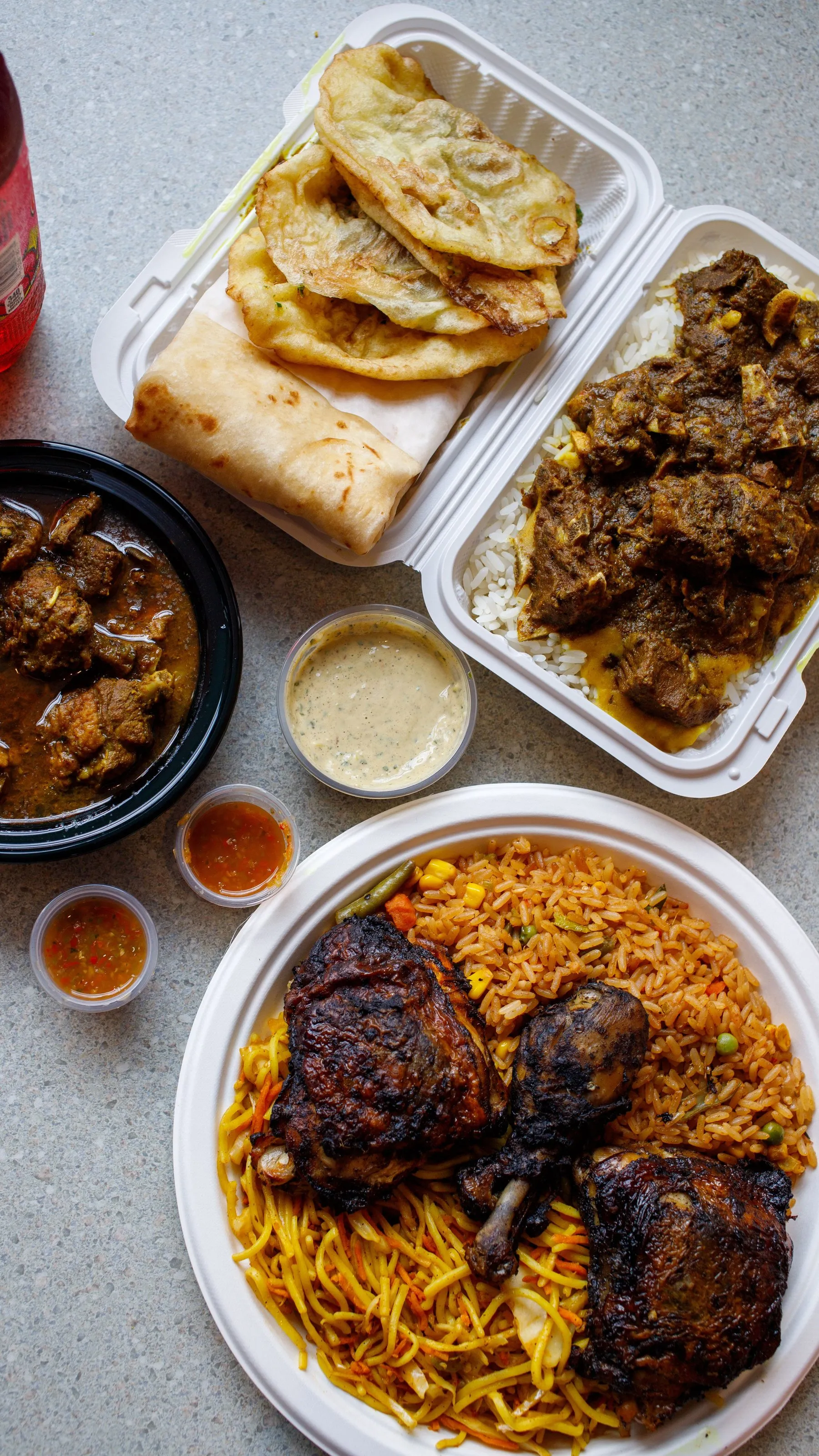 Grace Quisine takeout tray with jerk chicken and sides